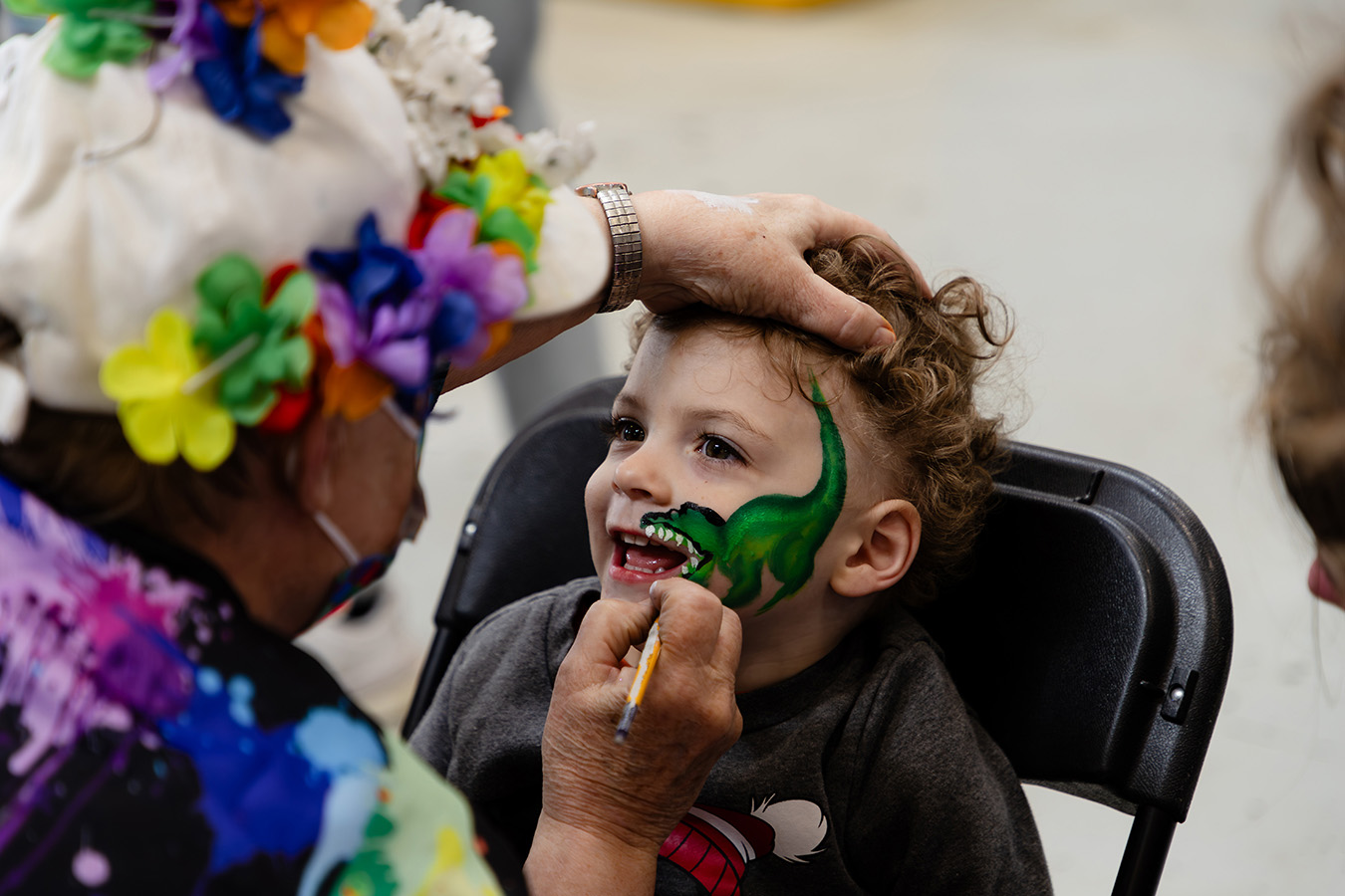 Child getting his face painted at Family Fun Day