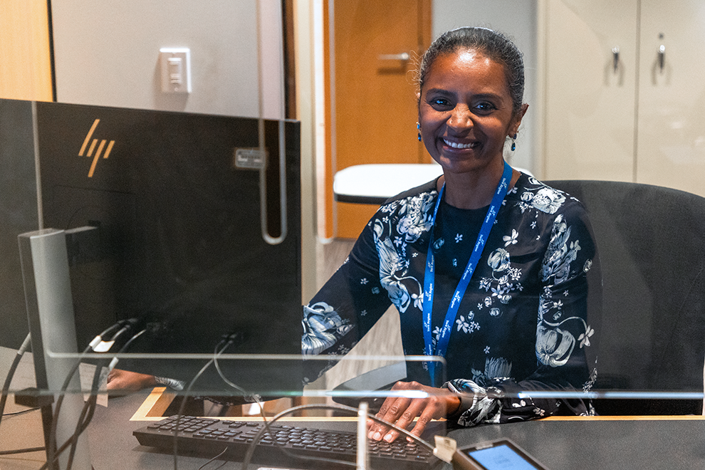 a court services clerk sitting at a desk