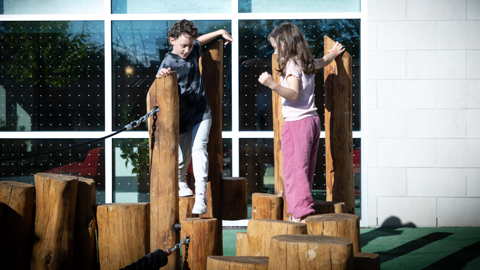 two young children playing outside
