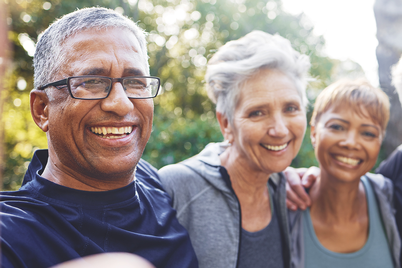 Three seniors smiling
