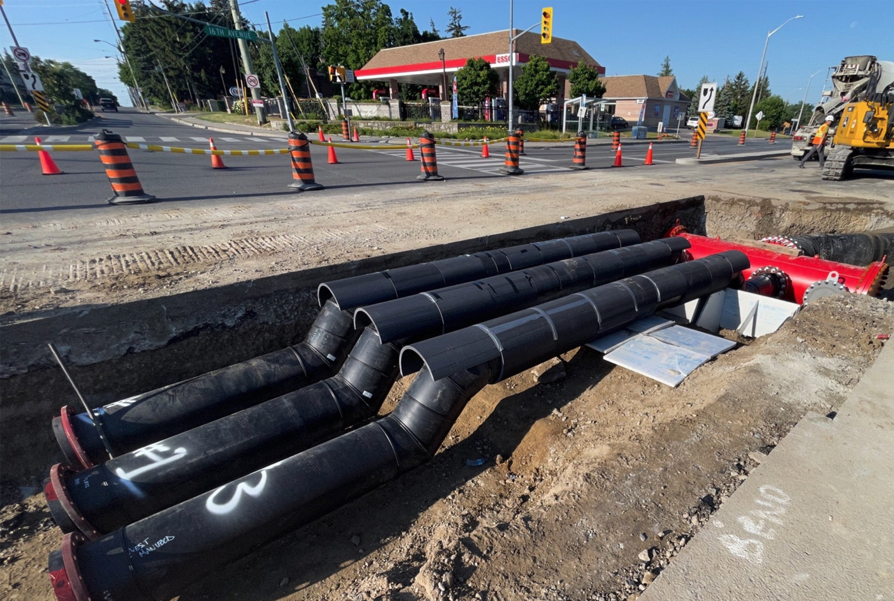 Temporary sewage bypass pipes along 16th Avenue