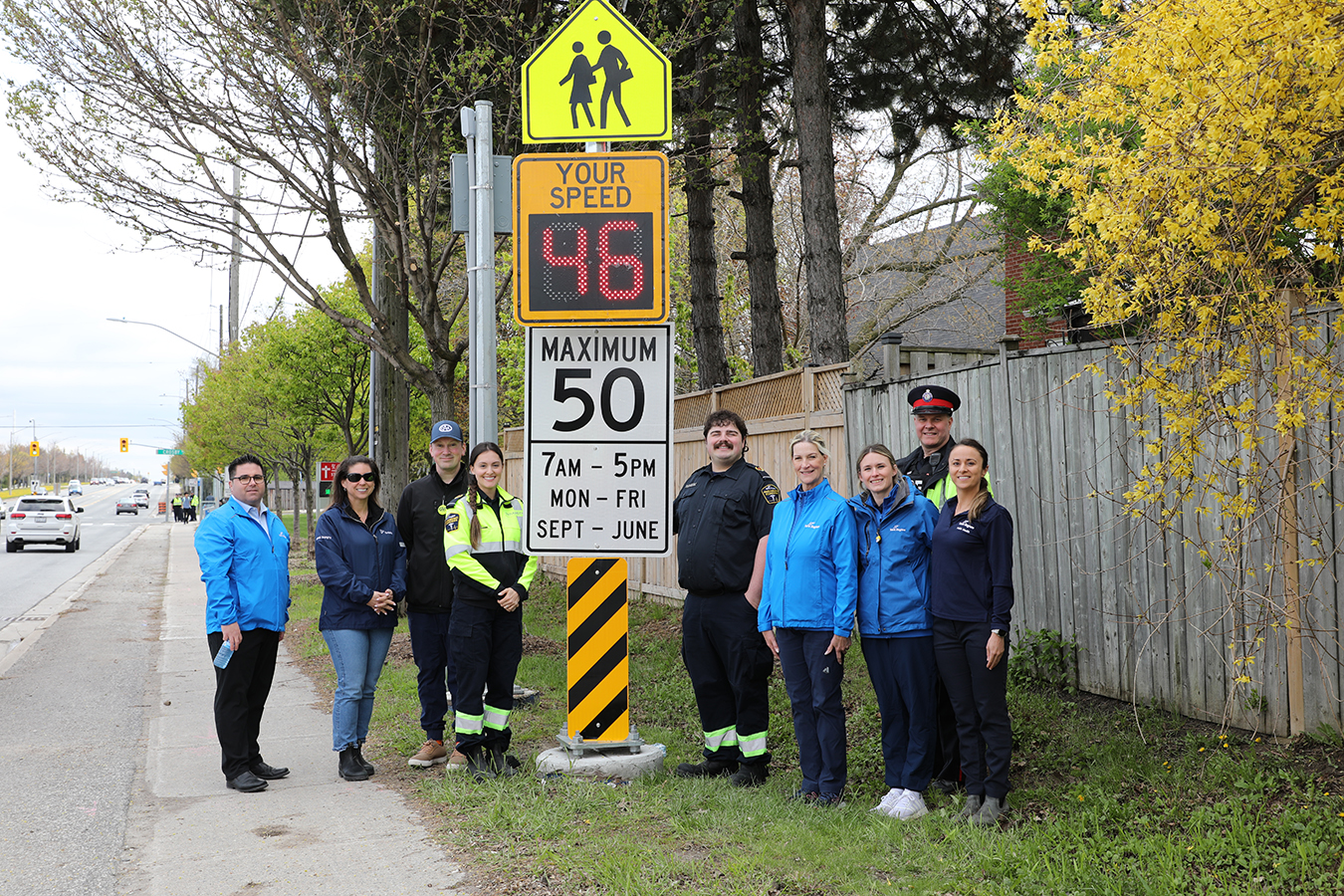York Region, York Region Paramedic Services, York Regional Police and traffic safety partners with the new speed feedback board near Our Lady Queen of the World Catholic Academy