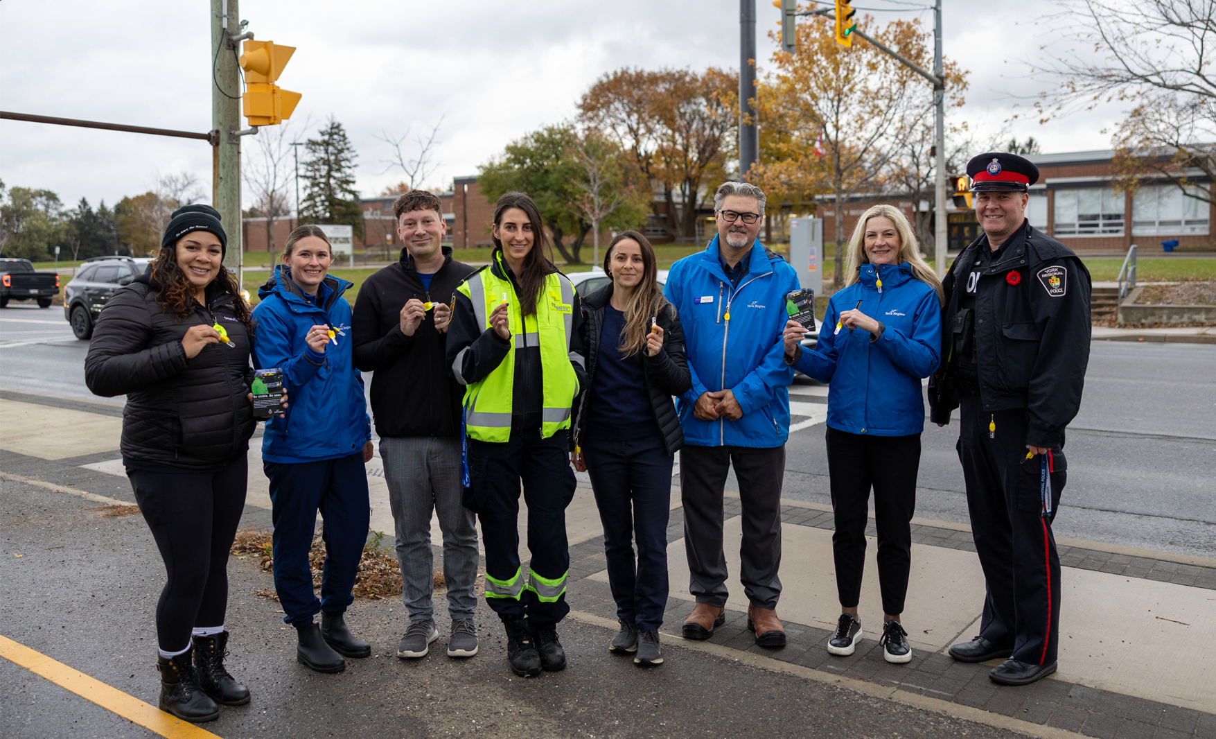 staff at an intersection near a school