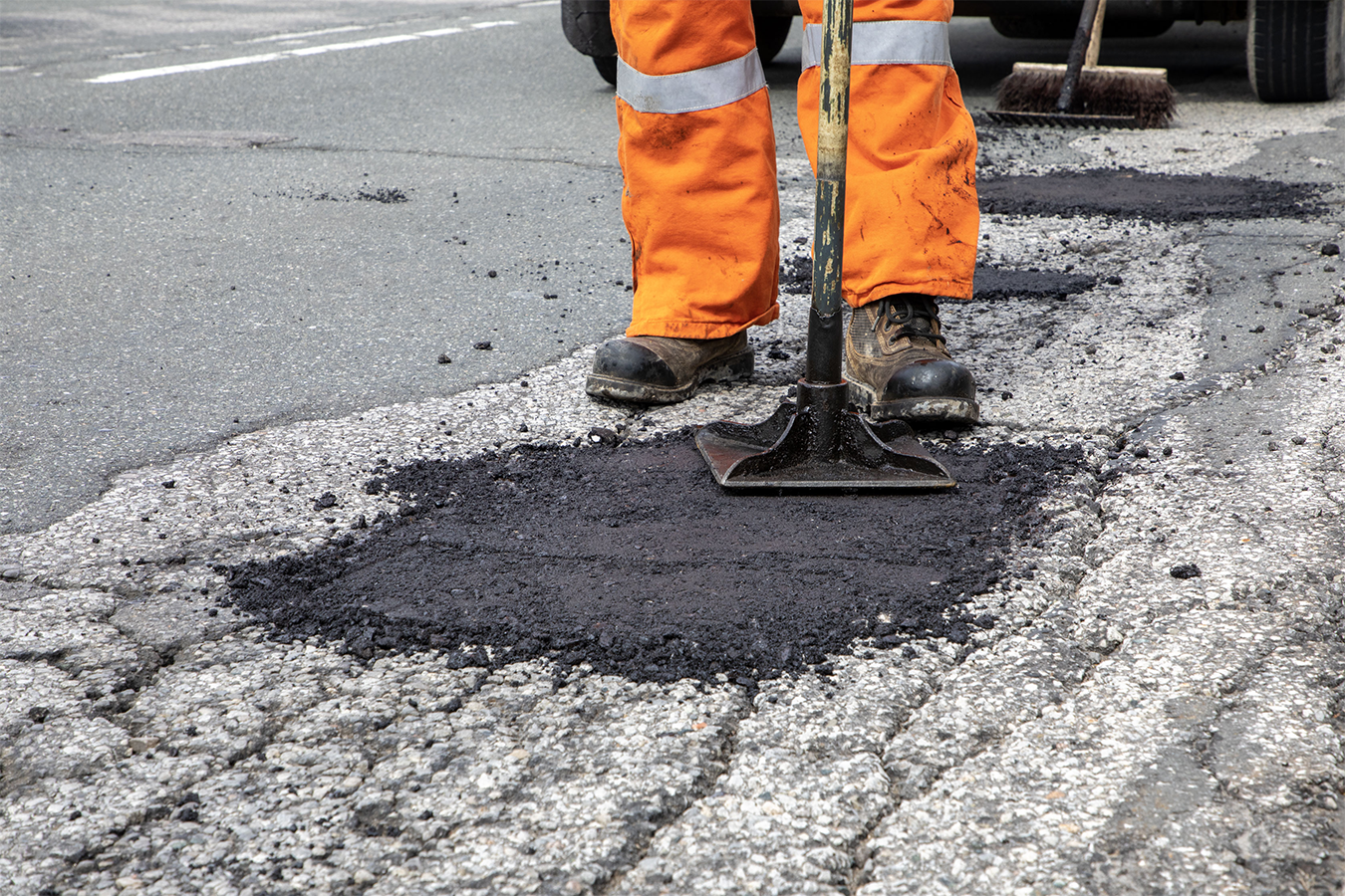 York Region staff filling pot hole