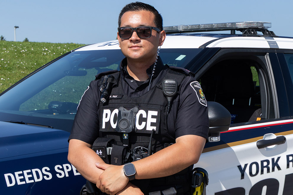 York Regional Police Officer standing outside of their vehicle