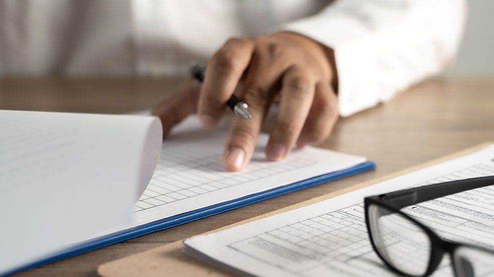 Person writing a policy document