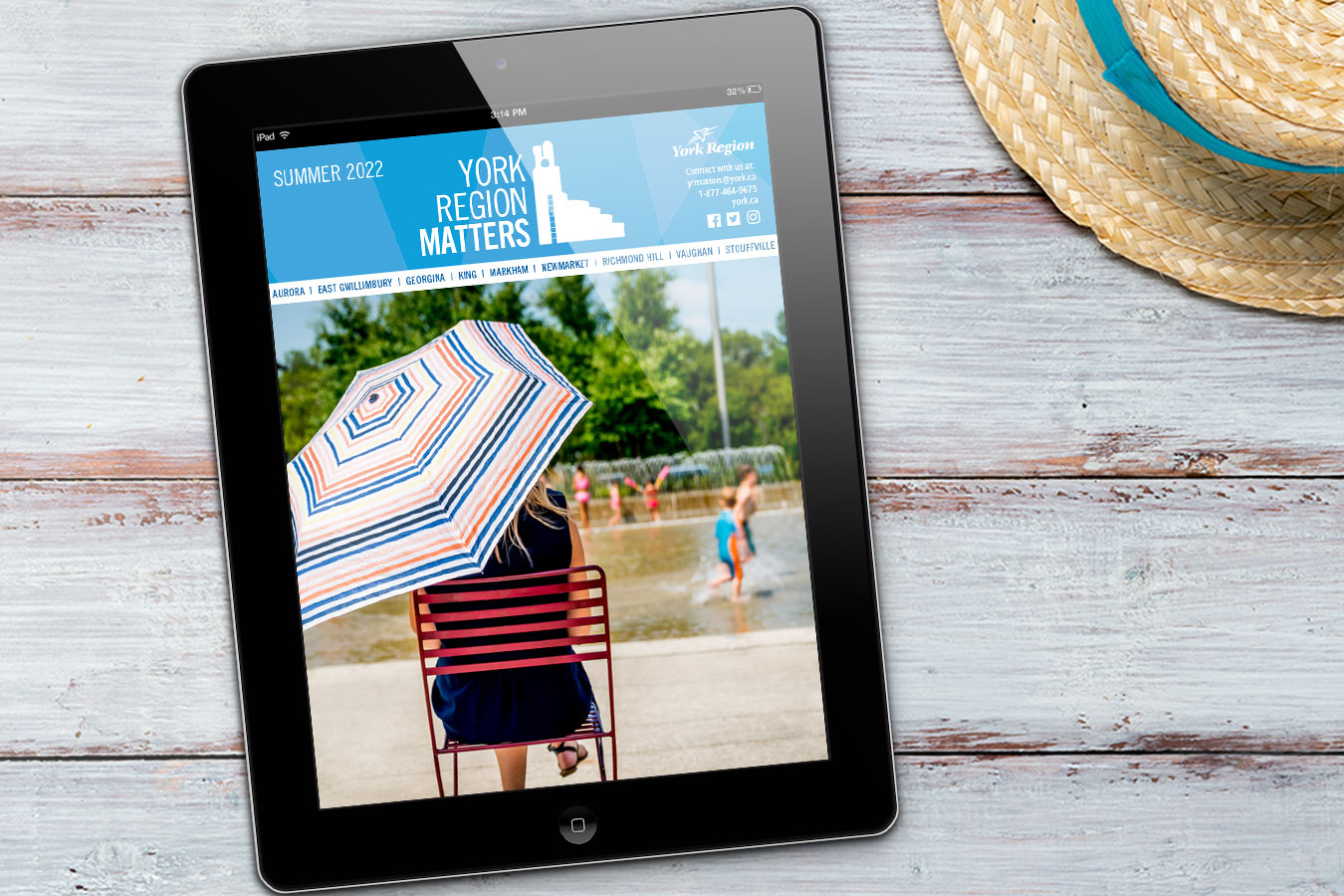 photograph of a person sitting under an umbrella