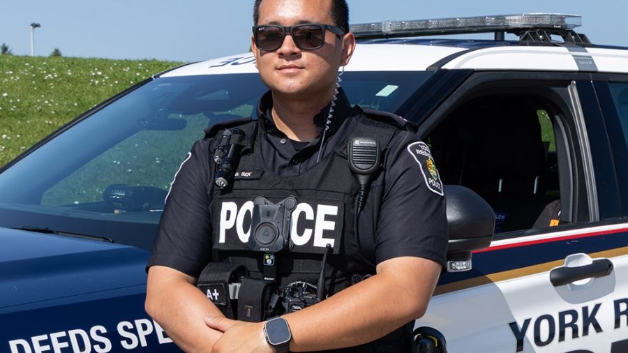 York Regional Police Officer standing outside of their vehicle