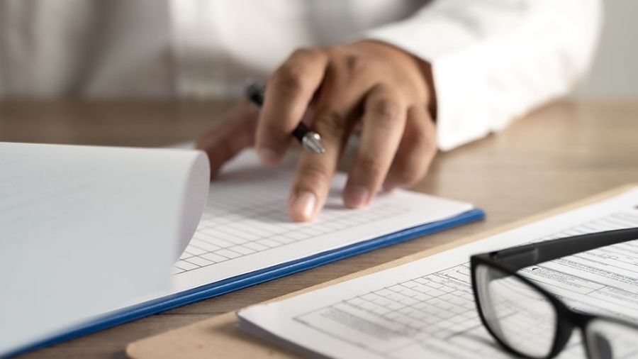 Person writing a policy document