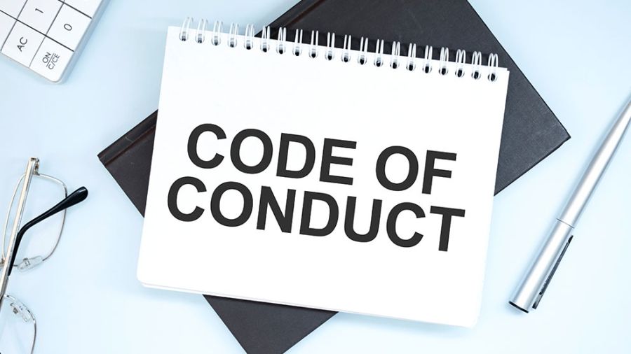 Book with the words code of conduct written on it