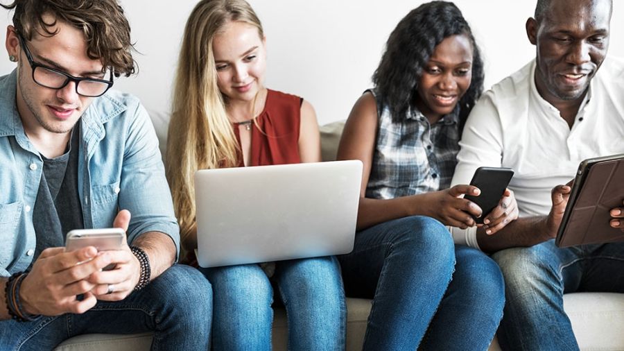 teens looking at a computer