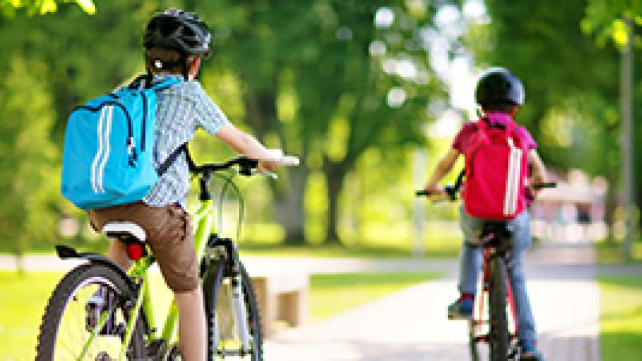 Children cycling to schoold