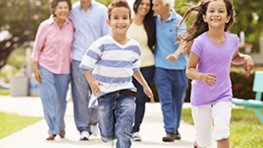 A multi-generational family is going for a walk together