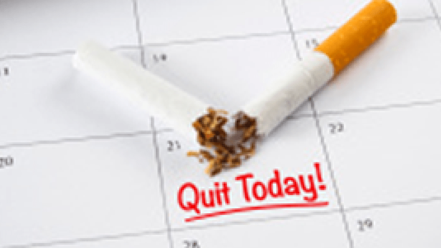 A calendar with a broken cigarette and the text Quit Today!