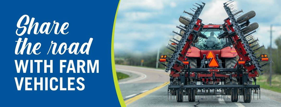 Farm vehicle on road with tagline share the road with farm vehicles