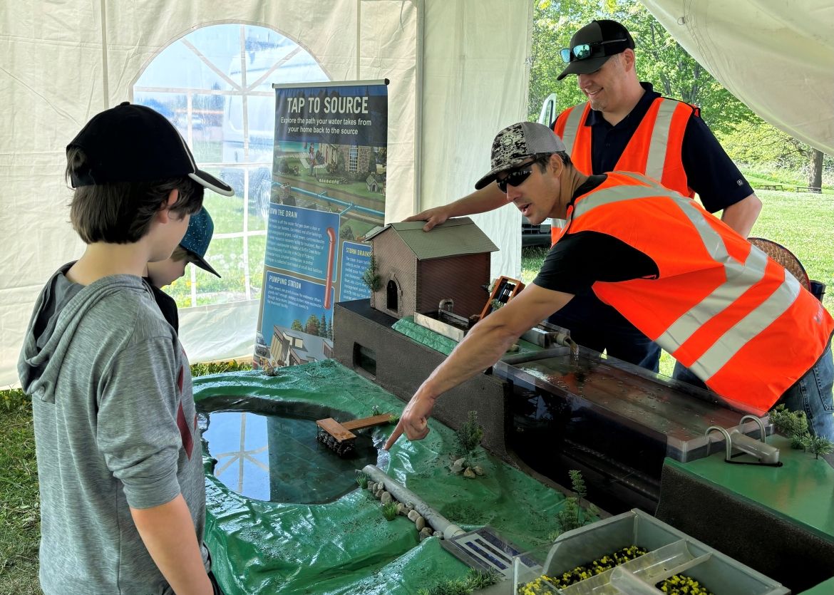 York Region Staff showing a water table, at the York Childrens Water Frestival
