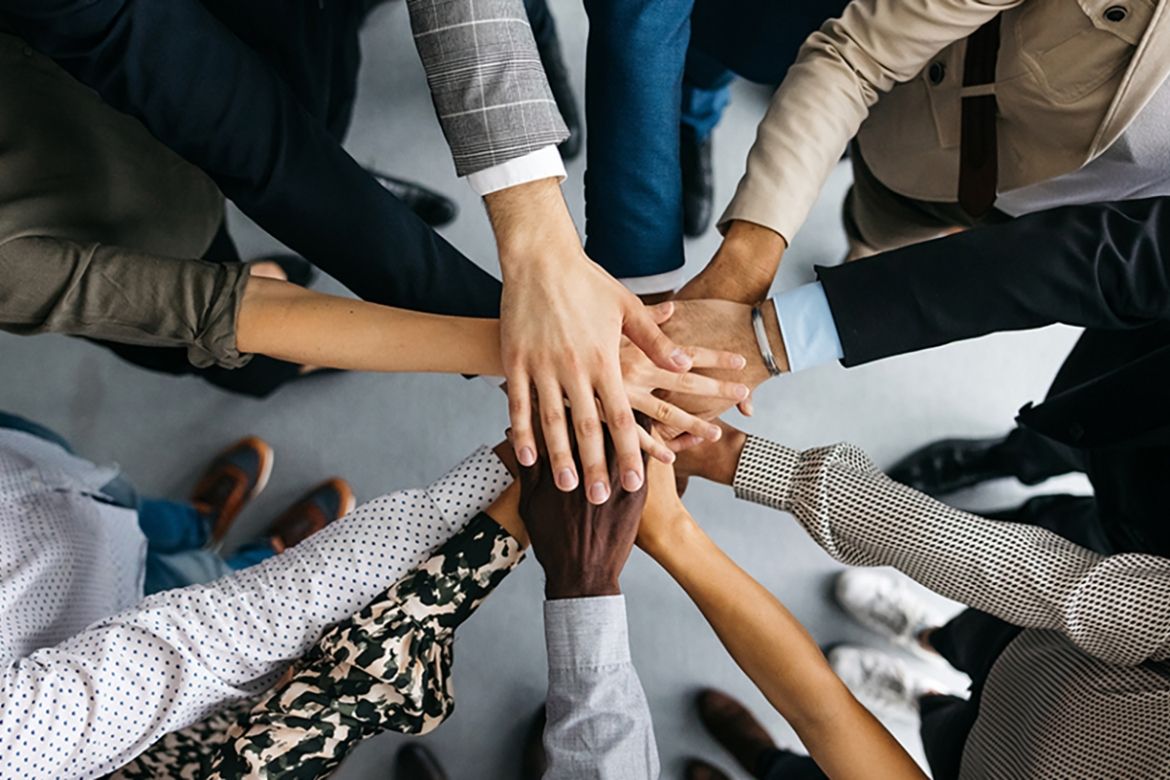 Group of hands in a circle