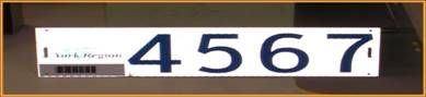 A white rectangular identification tag with the York Region logo in the upper left corner, a bar code in the lower left and a four digit number on the right.