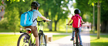 Children cycling to schoold