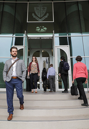 Image of workers on stairs outside of office building